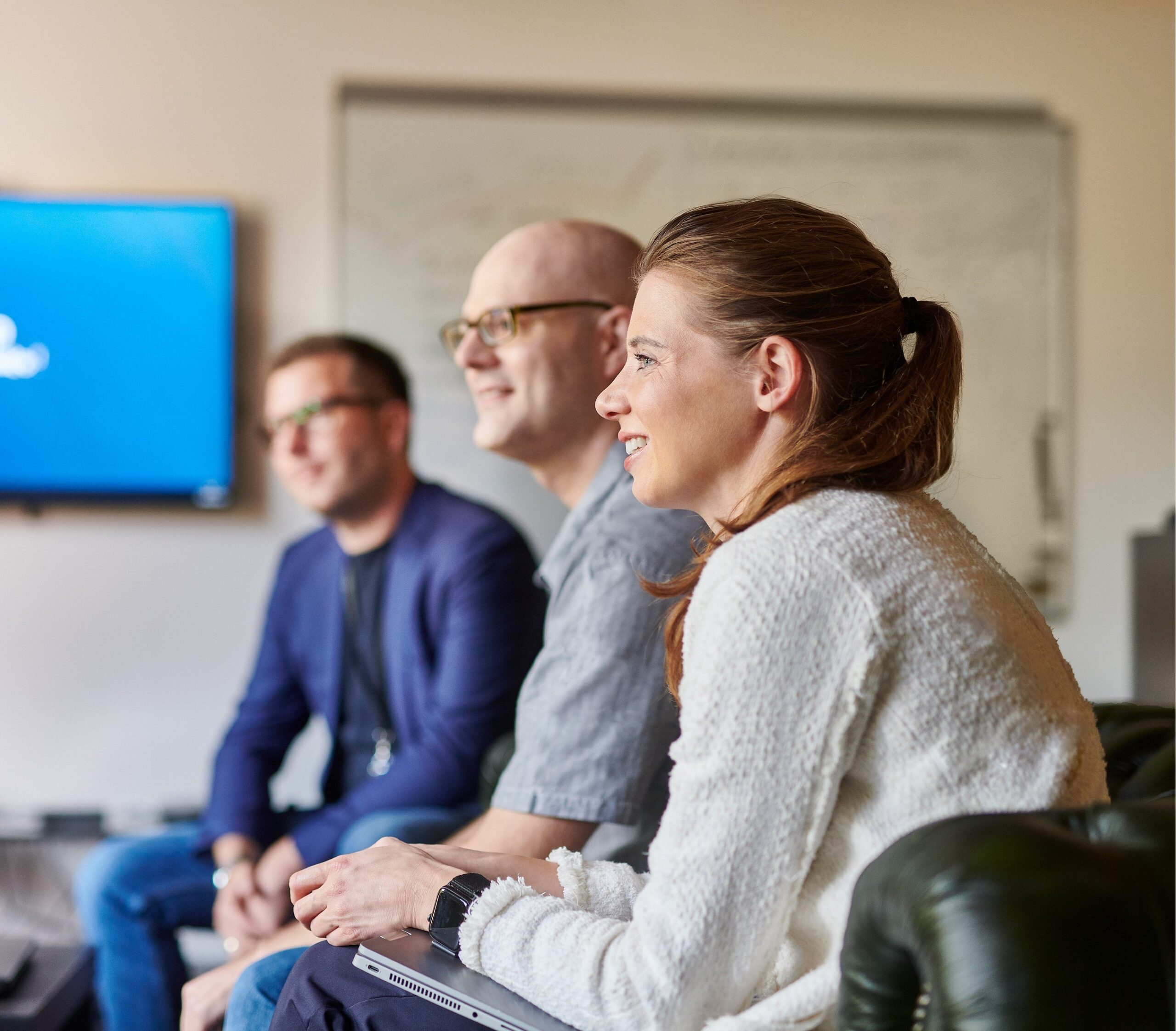 d.velop employees in permanent roles sitting together.