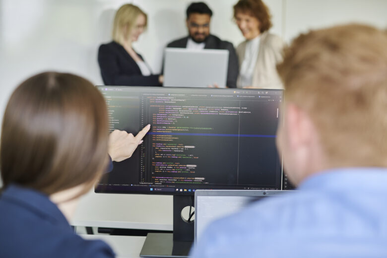 Two tech talents team up on a project – coding, collaborating, and creating something great.